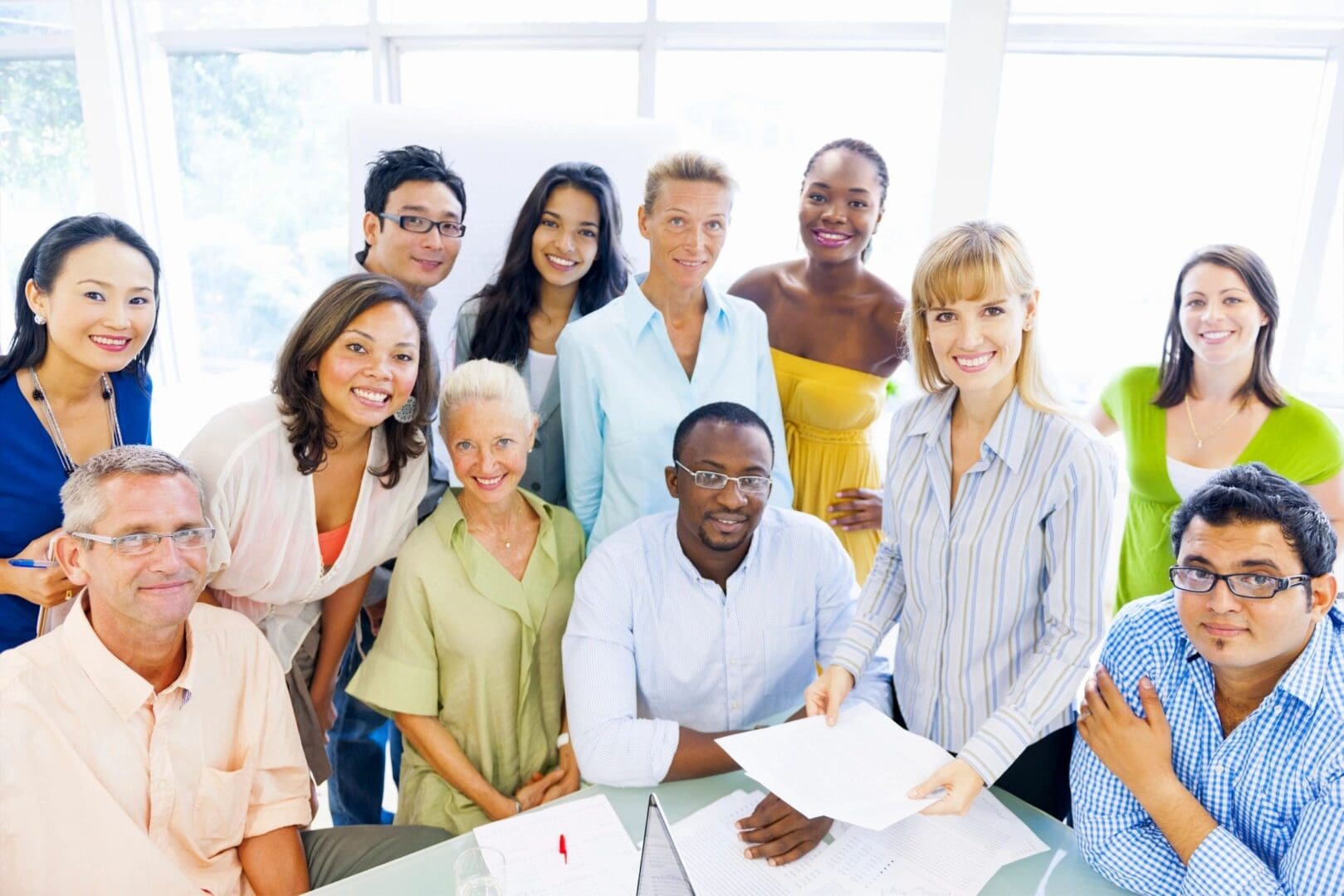 A group of people standing around a table.